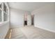 Carpeted bedroom with natural light showcasing open door to bathroom at 158 Palisade Dr, Rydal, GA 30171