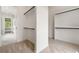 Spacious walk-in closet with built-in shelves and rods, offering plenty of storage space at 158 Palisade Dr, Rydal, GA 30171