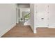 Bright foyer with hardwood floors and white trim at 158 Palisade Dr, Rydal, GA 30171