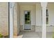 Elegant front door with brick accents and a modern design at 158 Palisade Dr, Rydal, GA 30171