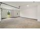 A spacious three car garage boasts windows allowing for natural light at 158 Palisade Dr, Rydal, GA 30171