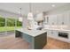 Kitchen with center island and breakfast bar, stainless steel appliances, and ample counter space at 158 Palisade Dr, Rydal, GA 30171