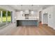 Modern kitchen featuring a center island, pendant lighting, and sliding glass doors leading to outdoor space at 158 Palisade Dr, Rydal, GA 30171
