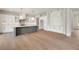 Bright kitchen featuring a center island, pantry, white cabinetry, and stainless steel appliances at 158 Palisade Dr, Rydal, GA 30171