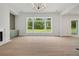 Bright living room featuring a fireplace and a large window at 158 Palisade Dr, Rydal, GA 30171