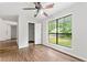 Light-filled bedroom with wood floors and a large window overlooking the yard at 845 Creek Trail Northwest Nw Trl, Kennesaw, GA 30144
