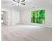 Large bedroom with neutral carpet, a large window, and a view of the outdoors at 845 Creek Trail Northwest Nw Trl, Kennesaw, GA 30144
