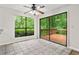 Dining area features large windows and sliding glass doors offering a view of the back deck and wooded area at 845 Creek Trail Northwest Nw Trl, Kennesaw, GA 30144