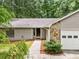 Attractive single-story home with stone accents around garage and front entrance at 845 Creek Trail Northwest Nw Trl, Kennesaw, GA 30144