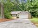 Well-maintained single-story home with an attached garage and a neatly landscaped front yard at 845 Creek Trail Northwest Nw Trl, Kennesaw, GA 30144