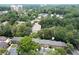 Aerial view of community with lush green trees and nearby amenities at 40 Olde Ivy Ne Sq, Atlanta, GA 30342