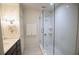 Modern bathroom with glass-enclosed shower, white subway tile, and vanity with storage at 40 Olde Ivy Ne Sq, Atlanta, GA 30342