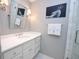 Bathroom featuring vanity, mirror, sconces and art at 40 Olde Ivy Ne Sq, Atlanta, GA 30342