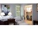 Bedroom featuring sitting area, desk, and walk-in closet with ample storage at 40 Olde Ivy Ne Sq, Atlanta, GA 30342