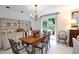 Bright dining room with a wooden table, hutch, and sliding doors to the outdoor patio at 40 Olde Ivy Ne Sq, Atlanta, GA 30342