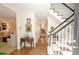 Spacious hallway with staircase and decor that leads to living spaces at 40 Olde Ivy Ne Sq, Atlanta, GA 30342