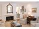 Cozy living room with a fireplace, comfortable seating, and refined decor for relaxation at 40 Olde Ivy Ne Sq, Atlanta, GA 30342