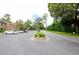 Community parking lot with mature trees and lush landscaping at 40 Olde Ivy Ne Sq, Atlanta, GA 30342