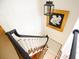View down staircase featuring black railing and decorative pendant lighting at 40 Olde Ivy Ne Sq, Atlanta, GA 30342