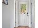 A well-lit interior view of a white door with glass, showcasing the home's clean and modern design at 451 Wilderness Camp Rd, White, GA 30184