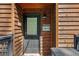Close up of the front door with wooden accents and lake-themed decor for a welcoming entrance at 451 Wilderness Camp Rd, White, GA 30184