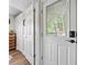 Hallway with storage and doors offering access to the home's various spaces at 451 Wilderness Camp Rd, White, GA 30184