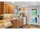 Efficient kitchen with wooden cabinetry, modern appliances, and a view to the lake, maximizing space and comfort at 451 Wilderness Camp Rd, White, GA 30184