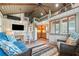 Inviting living room with a comfortable seating, wooden ladder to the loft, and scenic lake views at 451 Wilderness Camp Rd, White, GA 30184