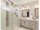 Modern bathroom featuring a glass enclosed shower and double sink vanity at 884 Mayfield Rd, Milton, GA 30009