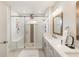 Modern bathroom featuring a glass enclosed shower, a double sink vanity, and white walls at 884 Mayfield Rd, Milton, GA 30009
