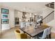 Open concept with dining area and kitchen featuring stainless steel appliances at 884 Mayfield Rd, Milton, GA 30009