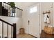 Inviting entryway featuring a wood floor, stylish door, and coat rack at 884 Mayfield Rd, Milton, GA 30009