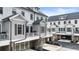 Beautiful townhome exteriors with balconies and driveways for convenient parking at 884 Mayfield Rd, Milton, GA 30009