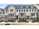 Charming townhome featuring a modern facade, well-kept landscaping, and inviting curb appeal at 884 Mayfield Rd, Milton, GA 30009