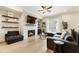 Comfortable living room showcasing a modern fireplace, sleek décor, and hardwood floors at 884 Mayfield Rd, Milton, GA 30009