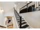 Staircase with black railing leading to another floor at 884 Mayfield Rd, Milton, GA 30009
