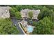 Aerial view of the complex showcasing the pool, landscaping, and ample parking at 123 Ashford Cir, Atlanta, GA 30338