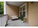 Cozy balcony features a loveseat and view, perfect for relaxing outdoors at 123 Ashford Cir, Atlanta, GA 30338