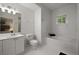 Well-lit bathroom with a classic design, featuring a soaking tub and vanity with a large mirror at 123 Ashford Cir, Atlanta, GA 30338
