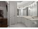 Bright bathroom features a double sink vanity, a tub, and a connection to the main bedroom at 123 Ashford Cir, Atlanta, GA 30338