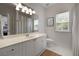 Bright bathroom features a modern vanity with ample storage and well-lit mirror at 123 Ashford Cir, Atlanta, GA 30338