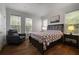 Relaxing bedroom with ample natural light, a comfortable chair, and stylish decor and modern lamps at 123 Ashford Cir, Atlanta, GA 30338