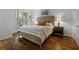 Bright bedroom with a comfortable bed, modern lamps, and scenic views from the large window at 123 Ashford Cir, Atlanta, GA 30338