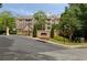 Ashford Condominiums community entrance with manicured landscaping and signage at 123 Ashford Cir, Atlanta, GA 30338