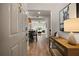 Inviting hallway with wood floors, console table, and view into the living and dining areas at 123 Ashford Cir, Atlanta, GA 30338