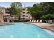 Gorgeous community pool features shallow areas for wading and several lounge chairs at 123 Ashford Cir, Atlanta, GA 30338