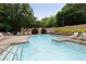 Beautiful community pool with comfortable lounge seating and manicured landscaping at 123 Ashford Cir, Atlanta, GA 30338