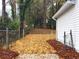 Backyard view, looking from house towards a chain-link fence and wooded area at 2068 Verbena Nw St, Atlanta, GA 30314