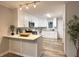 Bright kitchen features white cabinetry, stainless appliances, and granite countertops at 2068 Verbena Nw St, Atlanta, GA 30314