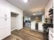 Bright kitchen featuring white cabinets, stainless steel appliances, granite countertops, and wood-look flooring at 2068 Verbena Nw St, Atlanta, GA 30314